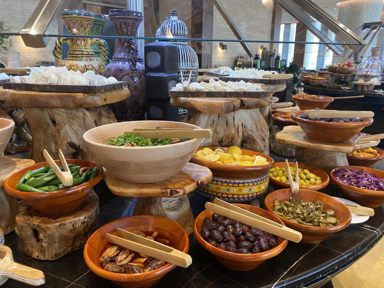 Movenpick Hotel And Residences Riyadh Exterior photo A selection of tapas at a buffet