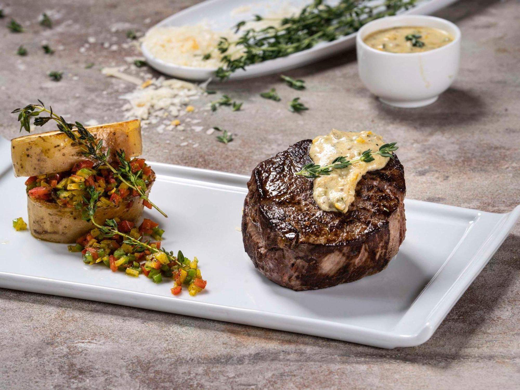 Movenpick Hotel And Residences Riyadh Exterior photo A steak prepared with a butter sauce